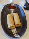 Egg rolls on a stylish plate