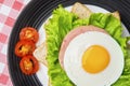 Egg sandwich decorated with sliced tomato Royalty Free Stock Photo