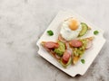 Egg and sausage sandwiches on a white rectangular plate on a light gray background Royalty Free Stock Photo