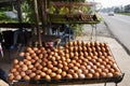 Egg scrambled mix with seasoning on antique old stove for grilled or roasted for sale travelers thai people travel visit at local Royalty Free Stock Photo