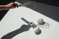 Egg with shadow from the fork. Minimalism. Cooking pastries, omelets. Easy. Whisk for whipping.