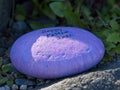 Egg-shaped stone with Happy Easter 2021 inscription Royalty Free Stock Photo