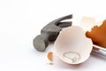 Egg shell is broken by a hammer and fake diamond ring in the egg shell. Royalty Free Stock Photo