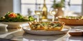 Egg and spinach quiche with cherry tomatoes on a plate in the kitchen. A healthy breakfast menu. Royalty Free Stock Photo