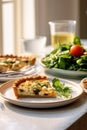 Egg and spinach quiche with cherry tomatoes on a plate in the kitchen. A healthy breakfast menu. Royalty Free Stock Photo
