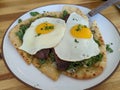 Egg and steak over naan bread tasty breakfast