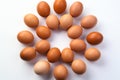 Egg Symmetry Brown chicken eggs forming a perfect circle on white