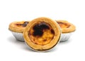 Egg tart in aluminum foil cup isolated on white background Royalty Free Stock Photo