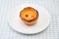 Egg tart cheese pie on a plate on table cloth