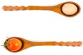 Egg and tomato on a wooden spoon. Royalty Free Stock Photo