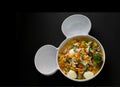 Egg vegetable and pork soup on black background,top view