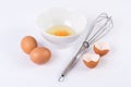 Egg white with the yolk in little bowl and other entries eggs with a whisking Royalty Free Stock Photo