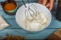 Beat egg whites and granulated sugar with an electric mixer. Royalty Free Stock Photo