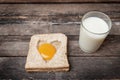 Egg with whole grain bread wooden background