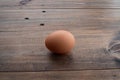 Egg on wood background, fresh egg