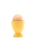 Egg in yellow eggcup Royalty Free Stock Photo