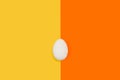 An egg on a yellow and orange background Royalty Free Stock Photo