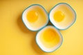 Egg yellow yolk in three bowls