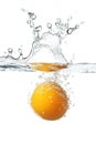 Egg yolk splashing into water creating bubbles Royalty Free Stock Photo