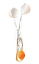 Egg yolk and white dropping out of brown cracked shell Royalty Free Stock Photo