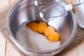 Egg yolks and sugar in a glass bowl Royalty Free Stock Photo