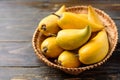 Eggfruit or canistel in a basket on wooden table