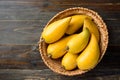 Eggfruit or canistel in a basket on wooden table