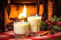 eggnog in a glass next to a cozy fireplace in a lodge Royalty Free Stock Photo