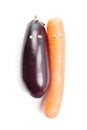 Eggplant, carrot with cartoon eyes isolated on white background