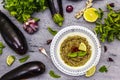 Eggplant dip baba ganoush mutabbal or mezze with ripe vegetables and fresh herbs