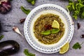 Eggplant dip baba ganoush mutabbal or mezze with ripe vegetables and fresh herbs