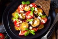 A Eggplant grilled with aromatic feta cheese and tomatoes Royalty Free Stock Photo