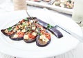 Eggplant with olive oil, basil and cherry tomatoes Royalty Free Stock Photo