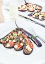 Eggplant with olive oil, basil and cherry tomatoes Royalty Free Stock Photo