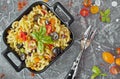 Eggplant, olives and tomato Elbow macaroni pasta, on a black serving platter Royalty Free Stock Photo