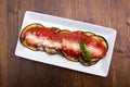 Eggplant parmigiana on wood from above Royalty Free Stock Photo