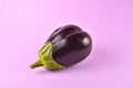 Eggplant on a purple background, fresh juicy vegetable on a colored background, selective focus, soft focus, close-up