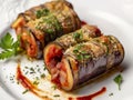 Eggplant rolls stuffed with cooked ham, ricotta and seasoned with tomato sauce