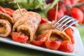 Eggplant roulades with cherry tomato salad. Royalty Free Stock Photo