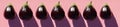 Eggplants in a row on a pink background. Many Aubergines. Top View. Sunny light and shadows. Table top. Creative layout Royalty Free Stock Photo