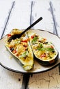 Eggplants stuffed with couscous , soft cheese and olives on white plate close up Royalty Free Stock Photo