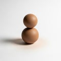 The eggs appear perfectly balanced with the smaller egg on top Royalty Free Stock Photo