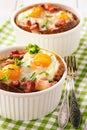 Eggs baked with bacon, tomatoes, garlic and bread. Royalty Free Stock Photo