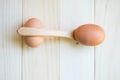 Eggs balance with wooden spoon