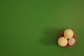 Eggs in a basket on a green background. White chocolate and white speckled eggs Royalty Free Stock Photo