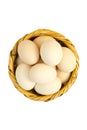 Eggs in a basket of reeds isolated