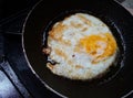 Eggs being fried on a frying pan. Fried egg. Selective focus. Royalty Free Stock Photo