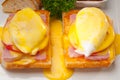 Eggs benedict on bread with tomato and ham Royalty Free Stock Photo