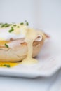 Eggs Benedict toasted English muffins ham poached eggs and hollandaise sauce Royalty Free Stock Photo