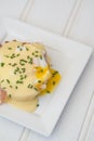 Eggs Benedict toasted English muffins ham poached eggs and hollandaise sauce Royalty Free Stock Photo